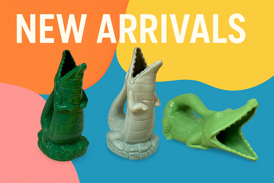 Three dinosaur-shaped gluggle jugs on a colorful background with 'NEW ARRIVALS' text.