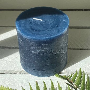 Rustic Inky Blue pillar candle by Grand Illusions, 100x100mm, featuring textured, handcrafted design in a natural style.