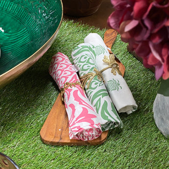 Grand Illusions leaf napkin holder with a sleek leaf design, perfect for organizing napkins on dining tables.