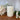Cream leaf pattern Macon pillar candle by Chic Antique, 45-hour burn time, showcasing elegant design and warm candlelight.