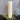 Cream rustic pillar candle by Chic Antique, 210-hour burn time, showcasing a textured, vintage-style candle on a decorative surface.