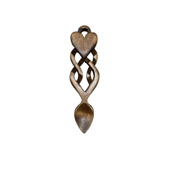 Welsh Love Spoon by Cadwyn Ltd featuring intricate wood carvings symbolizing friendship and eternity.
