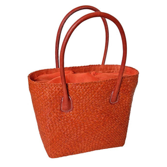 Camille Coral Tote Bag by Basket Basket featuring a vibrant coral-colored design and sturdy handles for everyday use.
