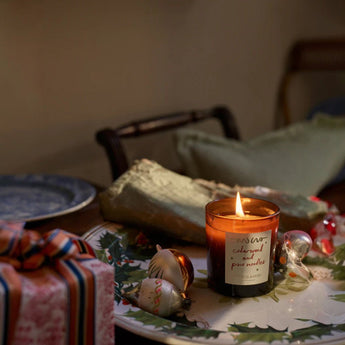 Plum & Ashby Cedarwood & Pine Needles scented candle with a glass jar and wooden lid, showcasing the candle and label.