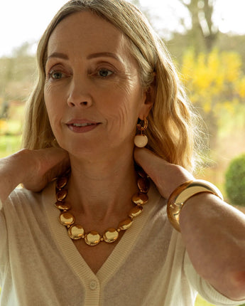 Gold Chalk UK large disc necklace with a sleek, minimalist design featuring a prominent circular pendant on a delicate chain.