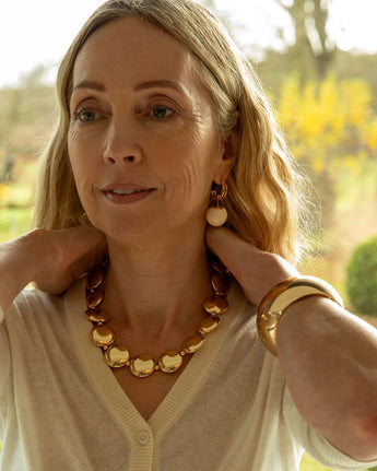 Gold Chalk UK large disc necklace with a smooth, round pendant hanging from a delicate chain.