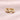 Gold hoop earrings from Attic Creations featuring a classic slim to wide design, showcasing a stylish and versatile jewelry piece.
