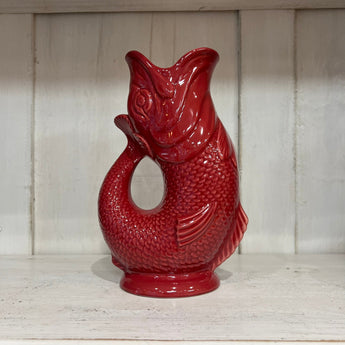 Large cranberry Gluggle Jug by The Gluggle Jug Factory, featuring a classic design and distinctive spout.