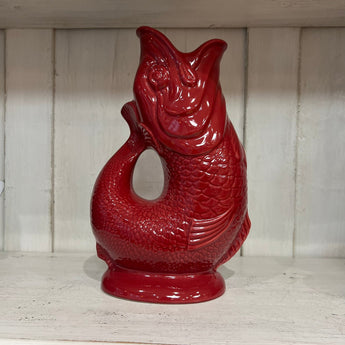 Cranberry-colored XL Gluggle Jug by The Gluggle Jug Factory, showcasing its distinctive spout and elegant design.