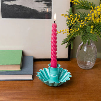 Aqua enamel cupped flower candle holder with a floral design, perfect for decorative candle displays.