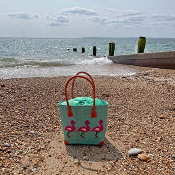 Pink flamingo small tote bag by Basket Basket with sturdy handles, perfect for casual outings and everyday use.