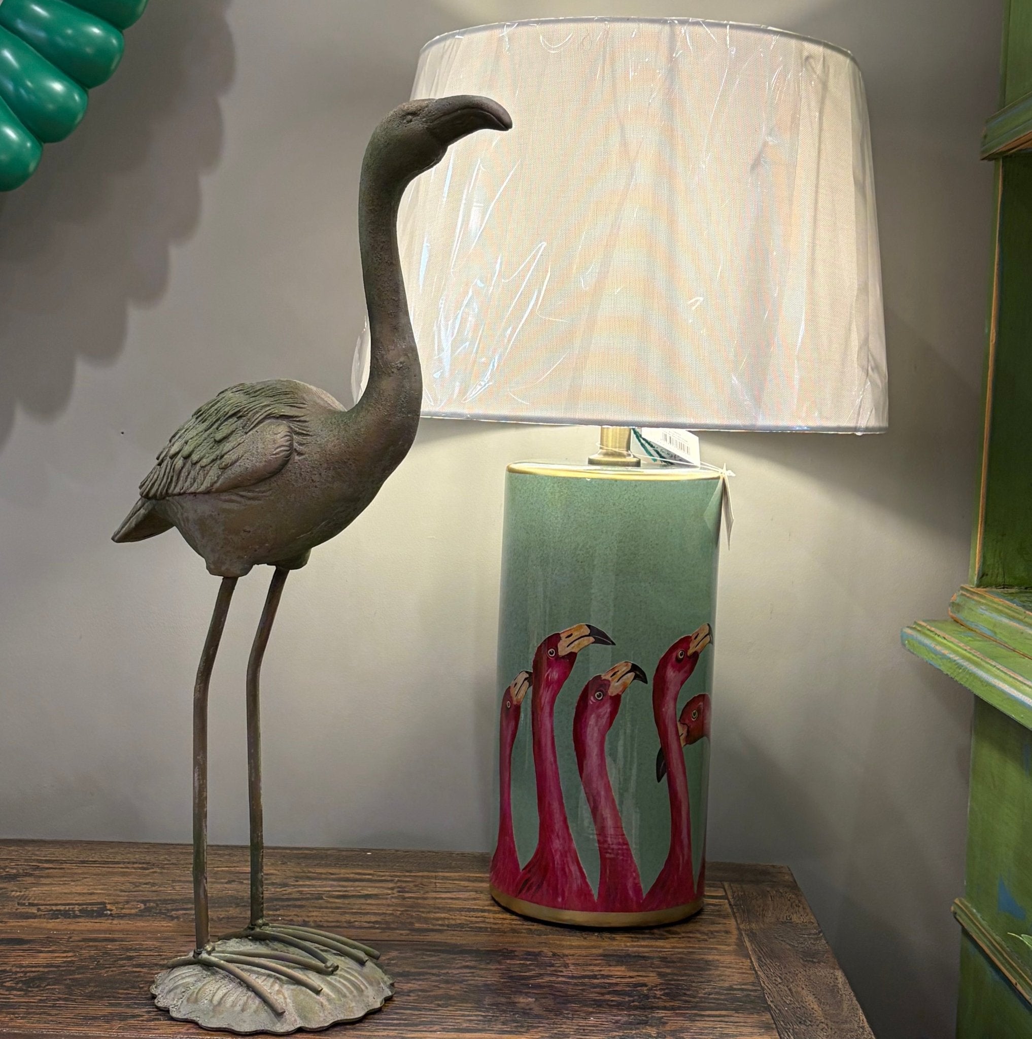 Colorful Flavia Flamingo garden ornament by Grand Illusions, featuring a vibrant pink flamingo figure for outdoor decor.