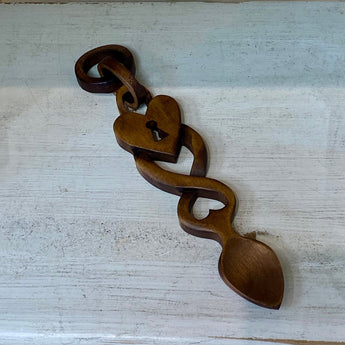 Welsh Love Spoon with entwined padlock design by Cadwyn Ltd, crafted from wood, featuring intricate carvings and traditional Welsh motifs.