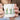 This is Nessie Garden Lover Mug featuring a colorful garden scene and a whimsical design, perfect for garden enthusiasts.