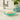 Teal glass soap dish from Grand Illusions with a sleek, transparent design for holding soap in a bathroom or kitchen.