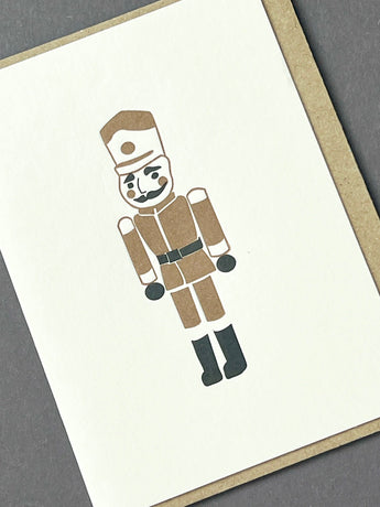 Gold Toy Soldier greeting card by Penguin Ink featuring a detailed illustration of a toy soldier in gold.