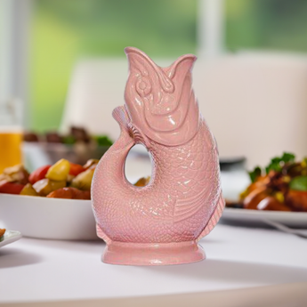Large baby pink Gluggle Jug from The Gluggle Jug Factory, featuring a classic ceramic design with a spouting fish-shaped spout.