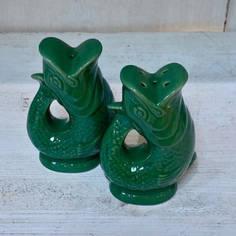 Green salt and pepper Gluggle Pots by The Gluggle Jug Factory, decorative ceramic spice shakers with traditional design.