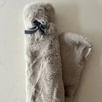 Grey long hot water bottle by Hunters Moon LTD, soft fabric cover, designed for warmth and comfort.