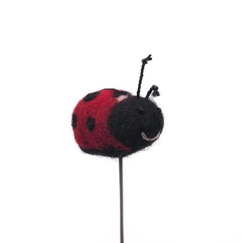 Ladybird felt decoration hanging on a wire, featuring detailed stitching and vibrant red and black colors, by Amica.