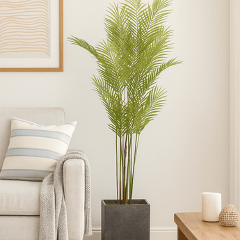 Large artificial Paradise potted palm by Hills Interiors, showcasing lush green foliage in a decorative pot.