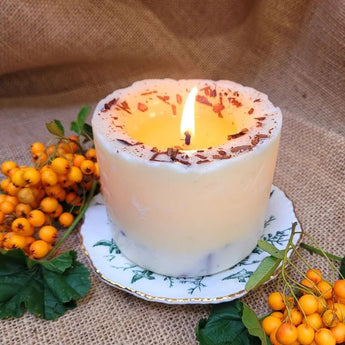 Large shredded cinnamon and orange soy wax scented candle by Beauty Scents, with a warm, rustic appearance and textured surface.