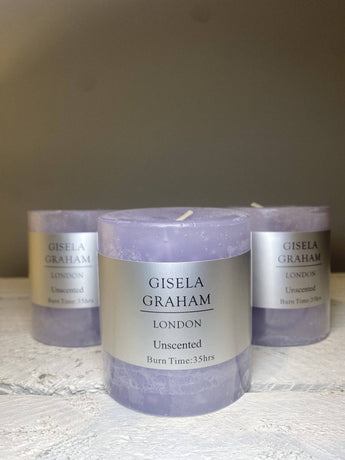 Lilac Mini Pillar Candle by Grand Illusions, 7cm tall, with a smooth wax surface and subtle floral scent.