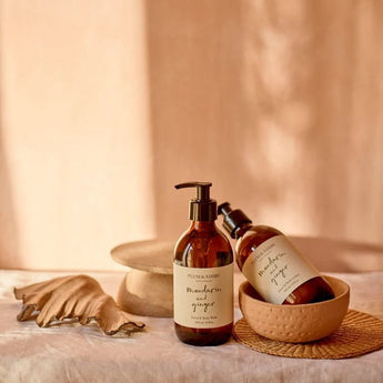 Plum & Ashby Mandarin & Ginger Hand and Body Lotion bottle with elegant packaging, showcasing a vibrant citrus and ginger scent.