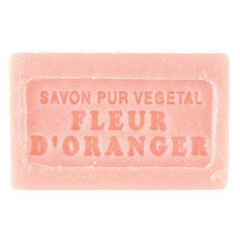 Bar of Grand Illusions Marseilles Soap Fleur D’Oranger with orange blossom scent, wrapped in elegant paper packaging.