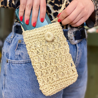 Mini beige crochet tassel crossbody bag by Bumble Living, featuring a compact design with tassel accents and adjustable strap.