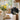 Mini black Highland cow felt decoration by Amica with a daisy flower, crafted from soft felt, perfect for decorative display.