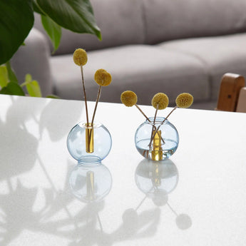 Blue and yellow glass mini bubble vase by Block Design, featuring a rounded shape and textured surface for decorative floral arrangements.