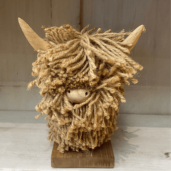 Small Highland Cow jute ornament featuring natural fibers, crafted by Aquarelle Home, ideal for rustic or farmhouse decor.