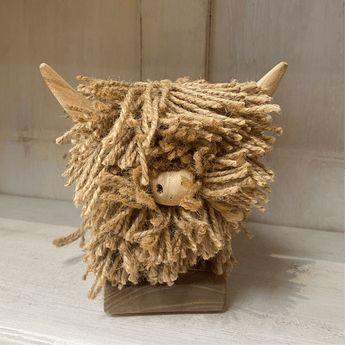 Tiny Highland Cow jute ornament by Aquarelle Home, natural and rustic animal ornament with detailed Highland cow features.