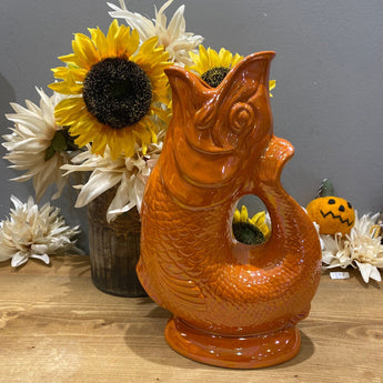 Orange Lustre Original Gluggle Jug XL by The Gluggle Jug Factory, showcasing its vibrant orange glazed ceramic design and traditional spout.