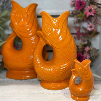 Orange Original Gluggle Jug Mini from The Gluggle Jug Factory, small ceramic jug with a distinctive spout and traditional design.