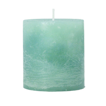 Pale green mini pillar candle, 7cm tall, from Grand Illusions, with a smooth wax surface and unlit wick.