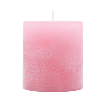 Pale pink mini pillar candle from Grand Illusions, 7cm tall, with a smooth surface and wax drip detail.