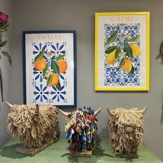 Blue photo frame with lemon Spanish tile print featuring pink lemons, measuring 60x40cm, by Bumble Living.
