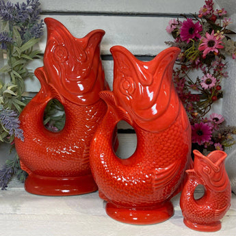 Large red Gluggle Jug by The Gluggle Jug Factory, featuring a classic design and glossy finish, perfect for decorative or functional use.