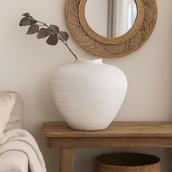 White ceramic vase from Hills Interiors' Regola collection, featuring a matte finish and elegant, modern design.