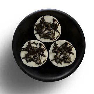 Freckleface RHS Botanic Earl Grey & Cucumber Wax Melts showing a cluster of wax pieces with botanical packaging.