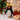 Amica felt decoration featuring a Rock Hopper penguin holding a holly sprig, perfect for holiday decor.