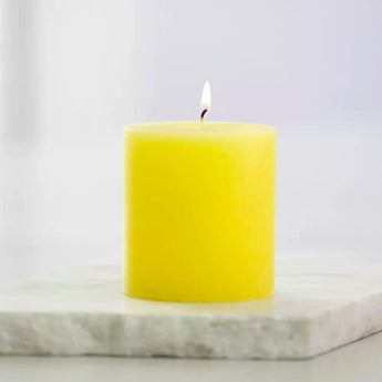 Rustic lemon-scented pillar candle by Grand Illusions, 70x75cm, showing a textured candle with a natural, rustic finish.