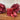 Rustic red pillar candle from Grand Illusions, 70x75mm, with a textured, natural finish and classic cylindrical shape.