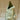 Sage XL Croggle Jug by The Gluggle Jug Factory featuring a distinctive curvy ceramic design and a large handle for pouring.