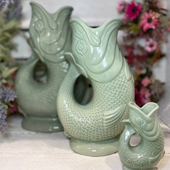 Sage Original Gluggle Jug XL made by The Gluggle Jug Factory, featuring a large ceramic pitcher with a spout and decorative design.