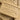 Chateau Du Savon Savon De Marseille Miel French soap bar with honey, creamy texture, and natural ingredients, resting on a wooden surface.