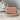 Chateau Du Savon Rose Broye French Marseille soap bar with a soft pink color and floral rose scent, displayed on a neutral background.