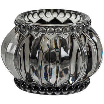 Gray scalloped votive candle holder by Grand Illusions with a textured, decorative edge, designed for small candles or tea lights.
